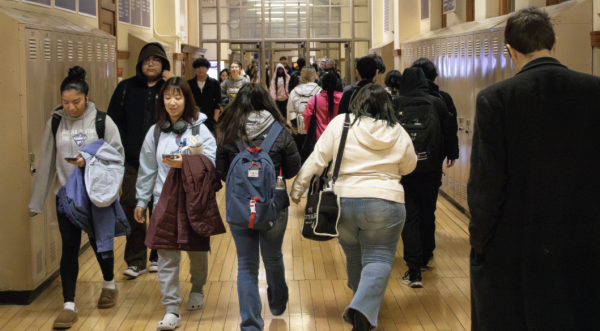 Students walk through the 3 side hallway between Eagle Time and 2nd block